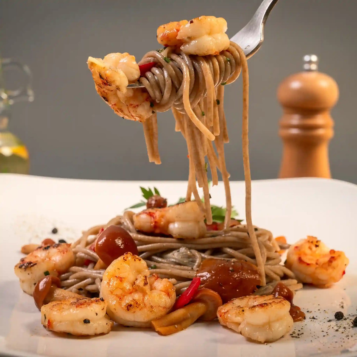 Plate of cooked Organic Einkorn Spaghetti with assorted ingredients